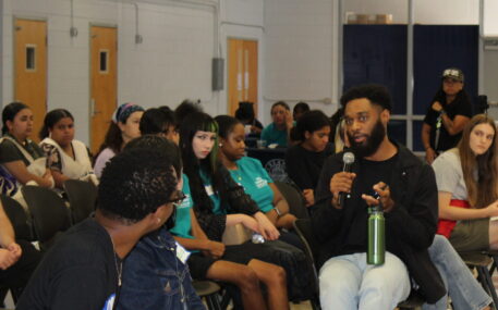 Participants discuss organizing at a community workshop.