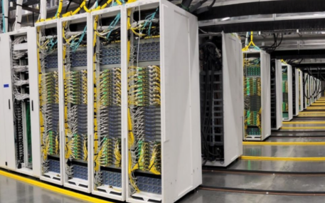 Rows of server racks inside a data center.